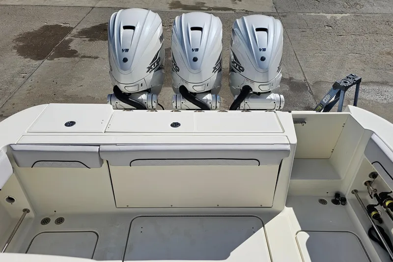 Slide: The Image of 2008 Hydra-Sports Vector 3500 VX with triple V8 outboard engines, docked on concrete. - 22