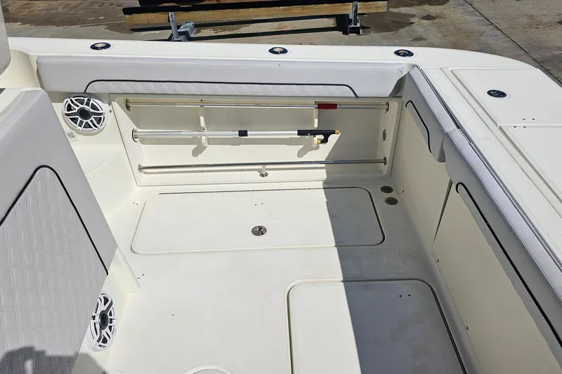 Slide: The Image of 2008 Hydra-Sports Vector 3500 VX boat interior with storage compartments and speakers. - 24