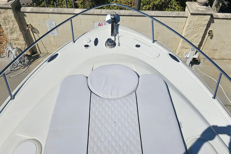 Slide: The Image of 2008 Hydra-Sports Vector 3500 VX boat deck with cushioned seating and railing. - 30