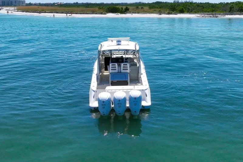 Slide: The Image of 2008 Hydra-Sports Vector 3500 VX boat on calm blue water near shoreline. - 4