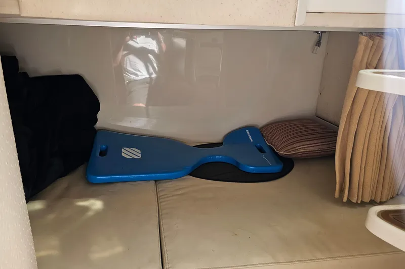 Slide: The Image of 2008 Hydra-Sports Vector 3500 VX cabin interior with blue seat cushion and striped pillow. - 40