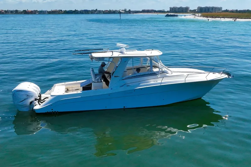 Slide: The Image of 2008 Hydra-Sports Vector 3500 VX boat on calm blue water, side view. - 6