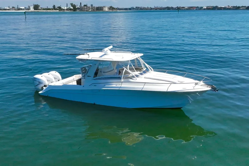 Slide: The Image of 2008 Hydra-Sports Vector 3500 VX boat on calm blue water, side view. - 7