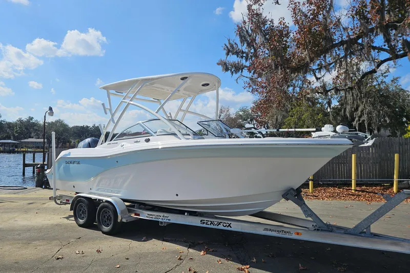 Slide: The Image of 2022 Sea Fox 226 Traveler with Minn Kota Terrova trolling motor under clear blue sky. - 2