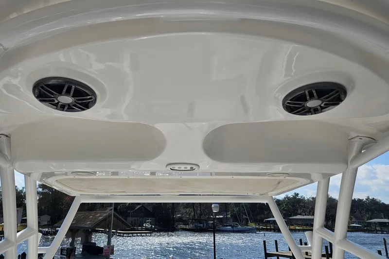 Slide: The Image of 2022 Sea Fox 226 Traveler boat interior with steering wheel and control panel. - 24