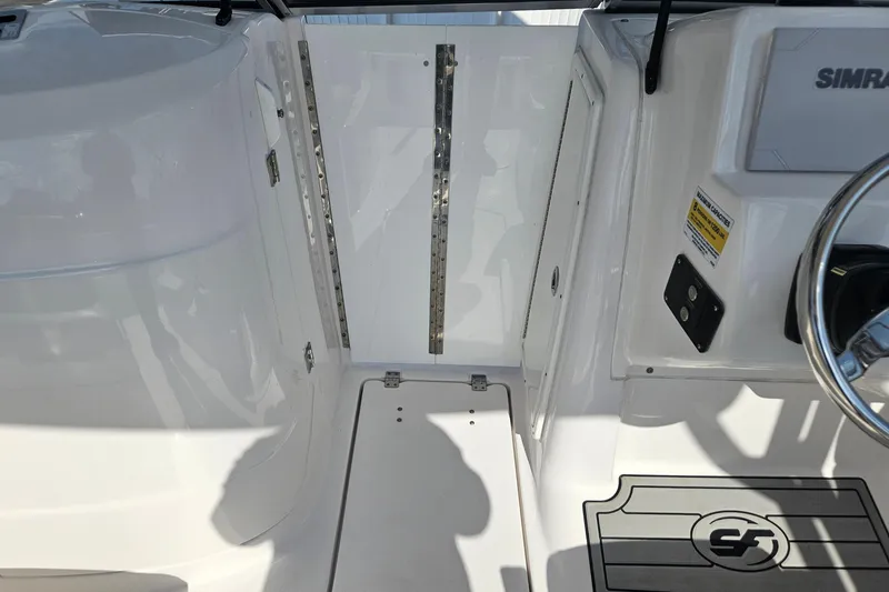 Slide: The Image of 2022 Sea Fox 226 Traveler boat interior with compact marine toilet. - 25