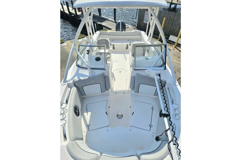 Slide: The Image of 2022 Sea Fox 226 Traveler boat interior with open storage compartment and steering wheel. - 28