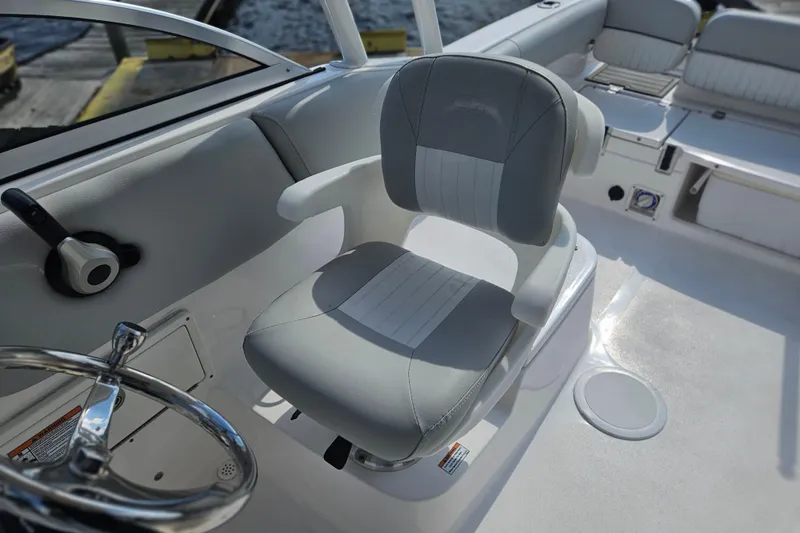 Slide: The Image of 2022 Sea Fox 226 Traveler boat interior with gray seating and storage compartments. - 31