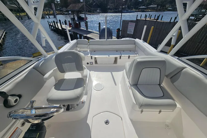 Slide: The Image of 2022 Sea Fox 226 Traveler boat interior with steering wheel and seating. - 33