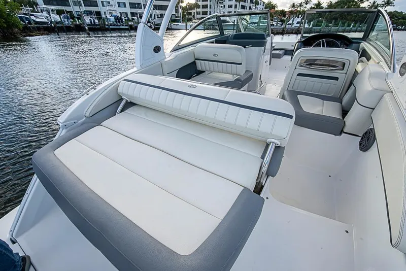 Slide: The Image of 2019 Cobalt 23SC boat interior with luxurious seating and waterfront view. - 14