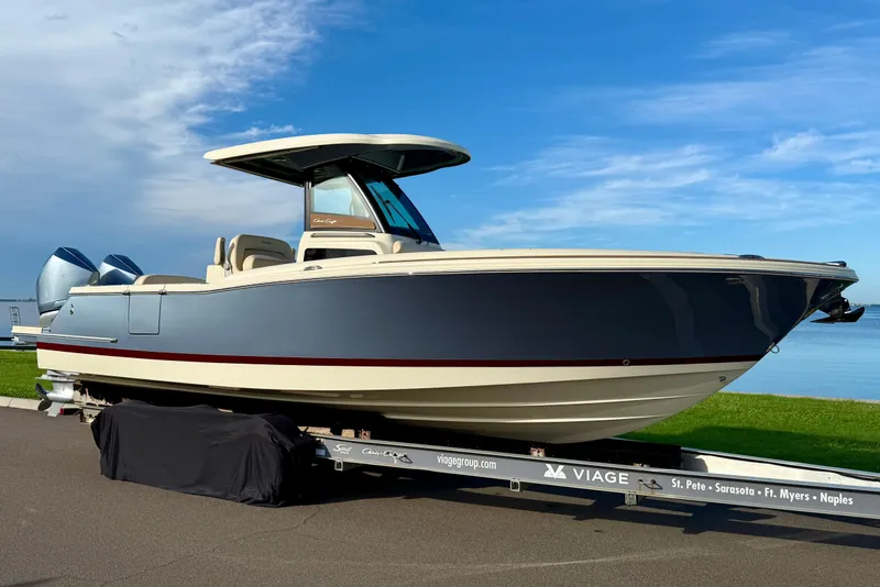 The Image of 2025 Chris-Craft Catalina 28 boat on trailer, blue sky background. - 0