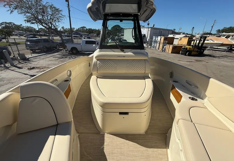 Slide: The Image of 2025 Chris-Craft Catalina 28 boat interior with beige seating and helm. - 15