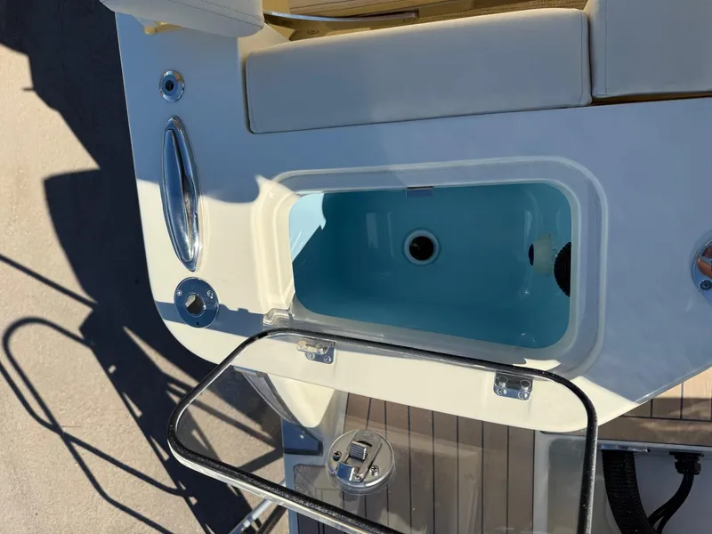 Slide: The Image of Chris-Craft Catalina 28, 2025 model, featuring a sleek deck design with built-in storage. - 19