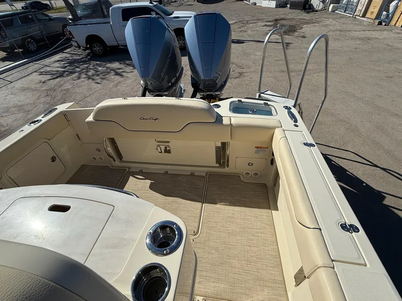 Slide: The Image of 2025 Chris-Craft Catalina 28 boat interior with dual engines and seating area. - 8