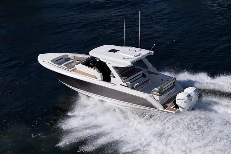 Slide: The Image of 2023 Tiara Yachts 34 LS cruising swiftly on the water. - 1
