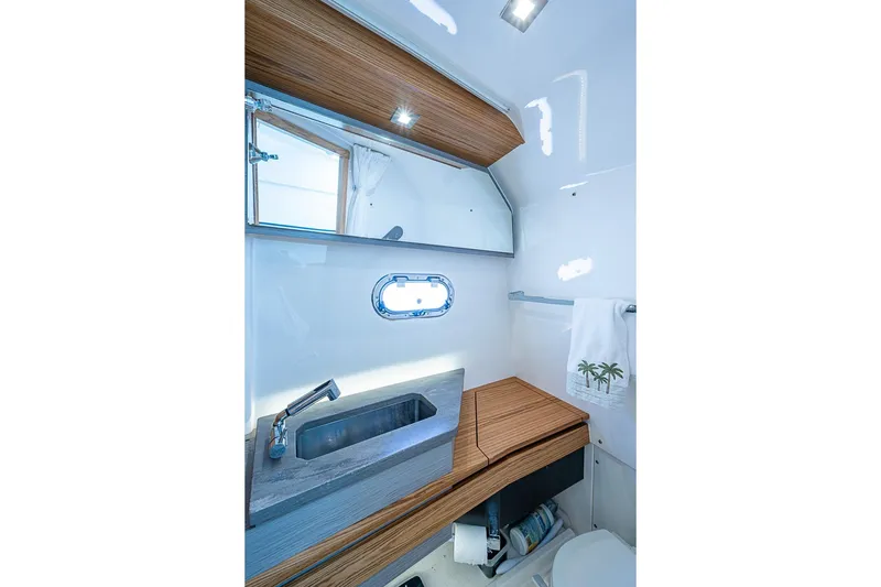 Slide: The Image of Luxurious bathroom interior of 2023 Tiara Yachts 34 LS with modern sink and wooden accents. - 17