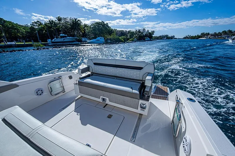 Slide: The Image of 2023 Tiara Yachts 34 LS cruising on a sunny day, featuring luxurious seating. - 26