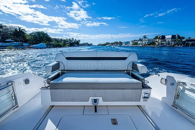 Slide: The Image of 2023 Tiara Yachts 34 LS luxury boat interior with scenic waterfront view. - 27