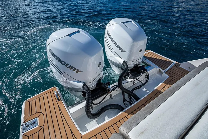 Slide: The Image of 2023 Tiara Yachts 34 LS with dual Mercury outboard engines on teak deck. - 44