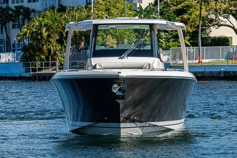 Slide: The Image of 2023 Tiara Yachts 34 LS luxury boat on water, front view. - 7