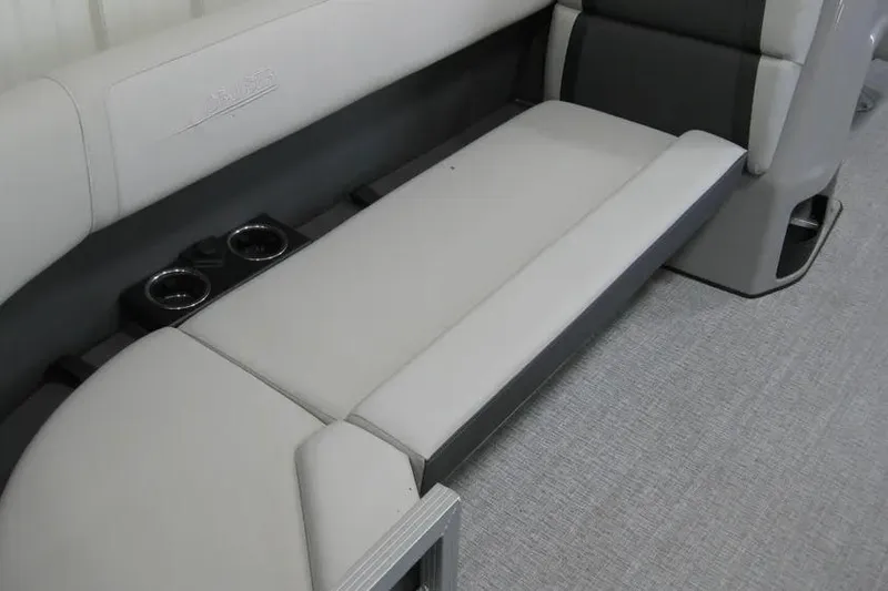 Slide: The Image of 2025 Harris FloteBote 230 Cruiser interior seating with cup holders, showcasing modern design. - 3