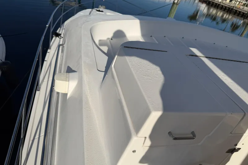 Slide: The Image of 2006 Neptunus 56 Flybridge yacht deck with railing and seating area. - 16