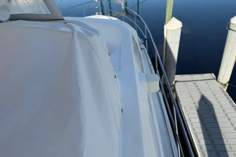Slide: The Image of 2006 Neptunus 56 Flybridge yacht docked, view of deck and railing. - 17