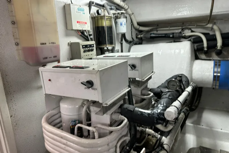 Slide: The Image of Engine room of 2006 Neptunus 56 Flybridge yacht with mechanical components and gauges. - 21