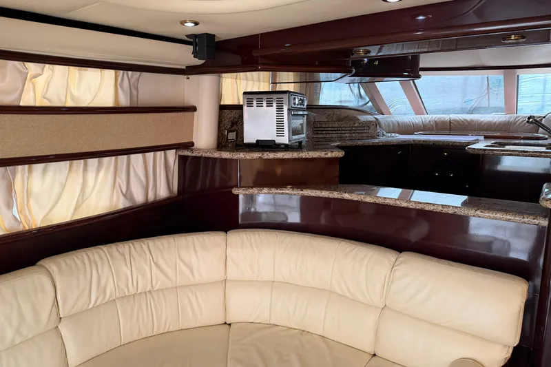 Slide: The Image of Luxurious interior of 2006 Neptunus 56 Flybridge yacht with leather seating and modern kitchen. - 22