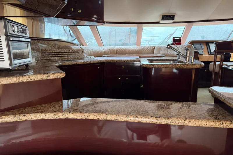 Slide: The Image of Luxurious 2006 Neptunus 56 Flybridge yacht interior with granite countertops and modern kitchen amenities. - 23