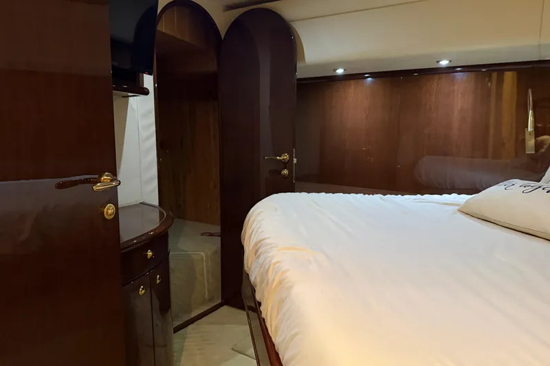 Slide: The Image of Luxurious cabin interior of 2006 Neptunus 56 Flybridge yacht with elegant wood finishes. - 27