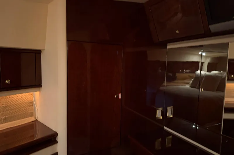 Slide: The Image of Luxurious interior of 2006 Neptunus 56 Flybridge yacht with polished wood finishes. - 39