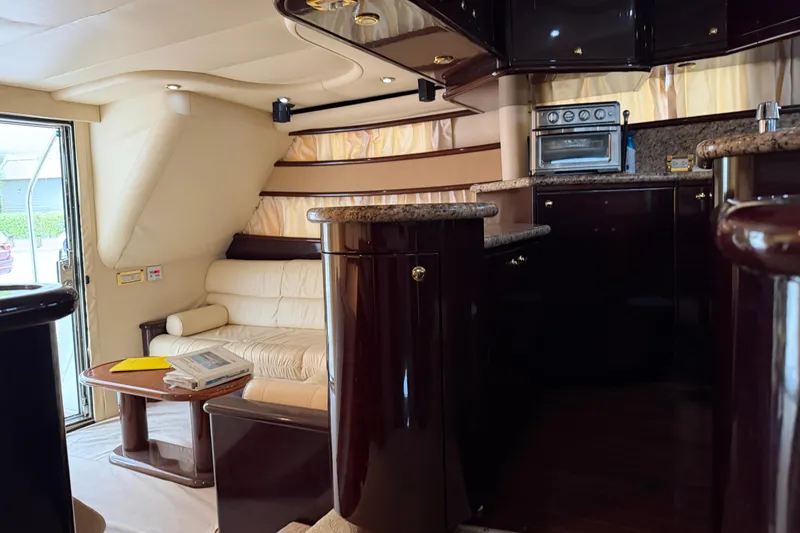 Slide: The Image of Luxurious interior of 2006 Neptunus 56 Flybridge yacht with elegant seating and modern kitchen. - 42