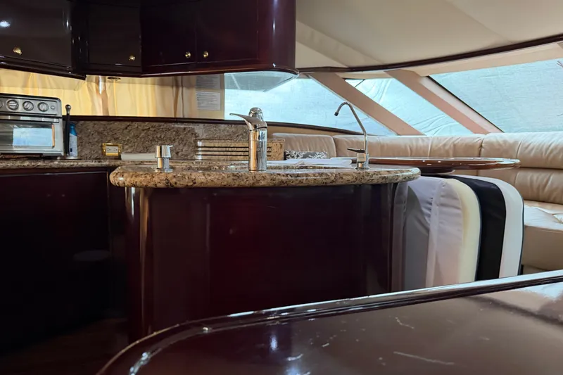 Slide: The Image of Luxurious interior of 2006 Neptunus 56 Flybridge yacht with modern kitchen and seating area. - 43