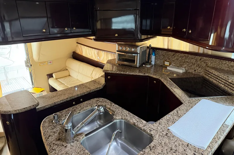 Slide: The Image of Luxurious kitchen interior of 2006 Neptunus 56 Flybridge yacht with granite countertops. - 46