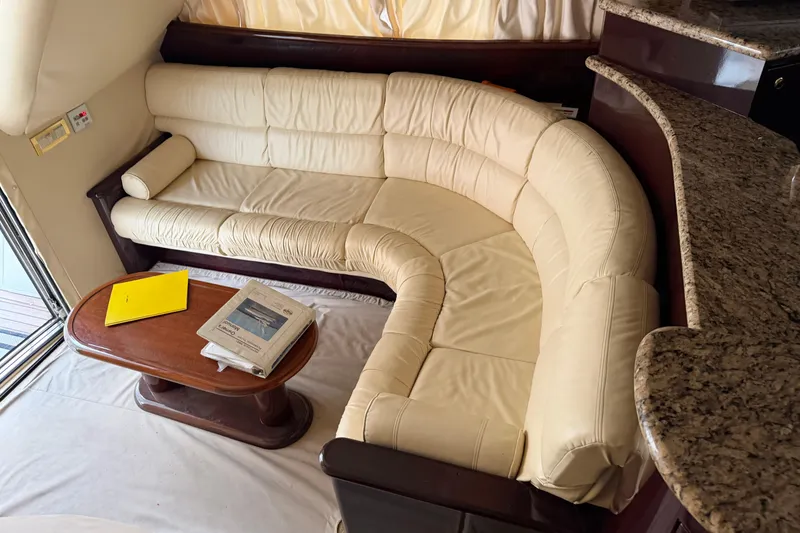 Slide: The Image of Luxurious interior of 2006 Neptunus 56 Flybridge with cream leather sofa and wooden table. - 51