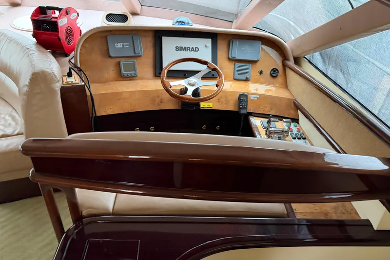 Slide: The Image of Helm of 2006 Neptunus 56 Flybridge yacht with Simrad navigation system. - 54