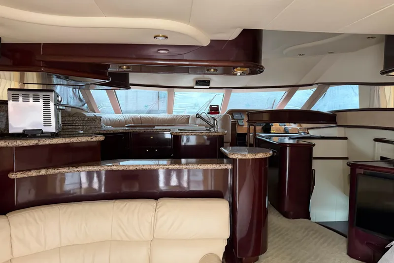 Slide: The Image of Luxurious interior of 2006 Neptunus 56 Flybridge yacht with elegant wood finishes. - 55