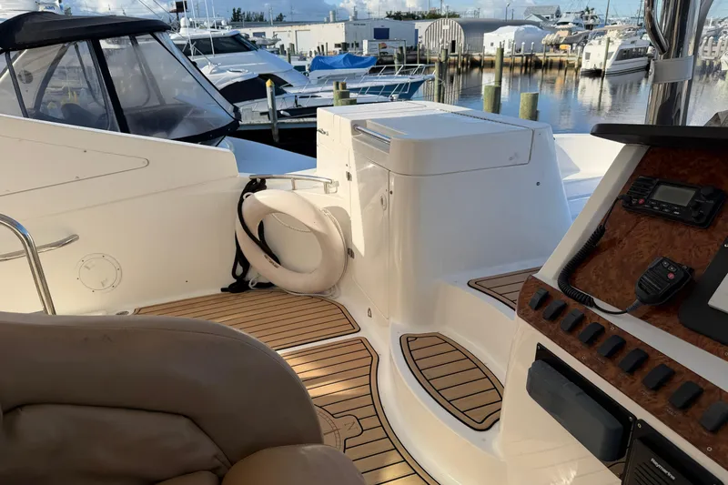 Slide: The Image of 2006 Neptunus 56 Flybridge yacht interior with wood flooring and control panel. - 9