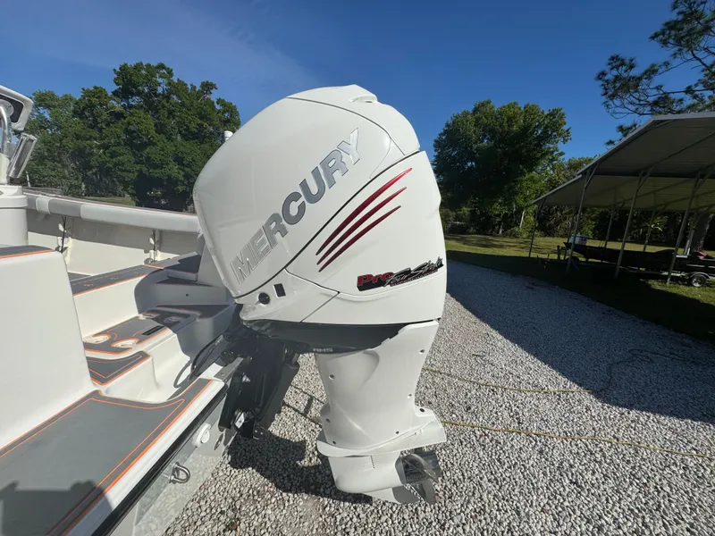 Slide: The Image of 2019 Mako 214C boat with Mercury outboard engine on gravel driveway. - 11