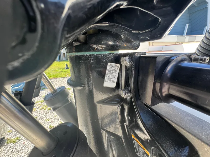 Slide: The Image of Close-up of a 2019 Mako 214C boat engine component with visible label. - 17