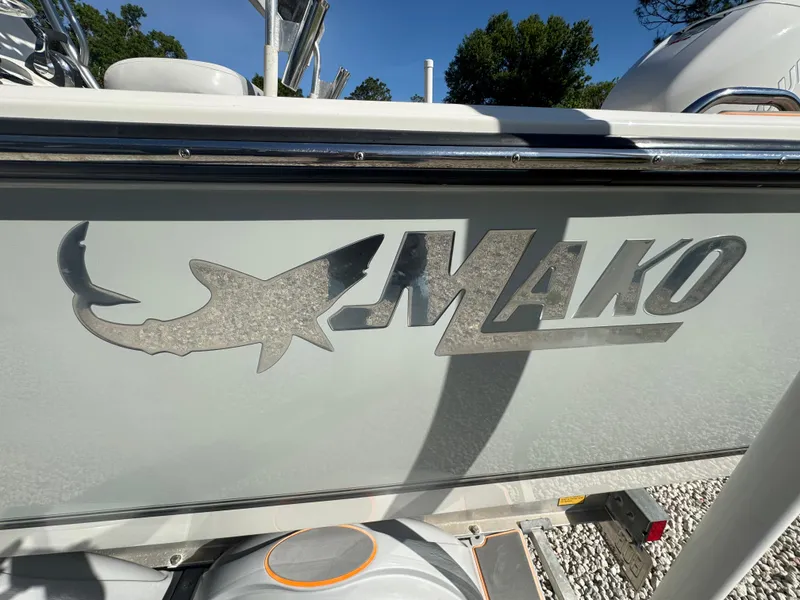 Slide: The Image of Mako 214C boat logo on side panel, 2019 model, with shark design. - 25