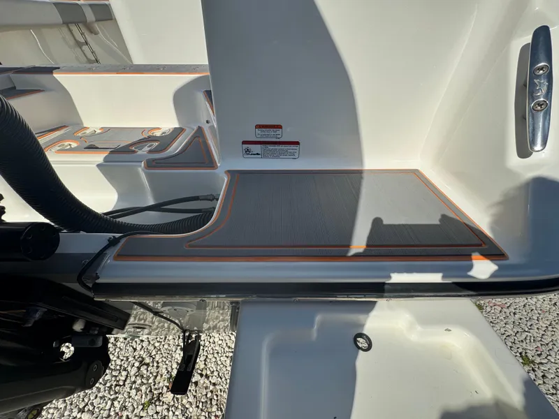 Slide: The Image of 2019 Mako 214C boat deck with non-slip surface and safety features. - 27