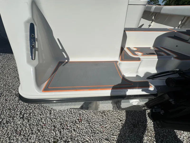 Slide: The Image of 2019 Mako 214C boat deck with non-slip surface and orange trim. - 28