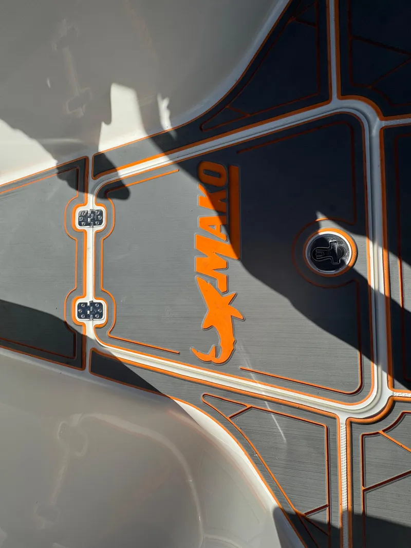 Slide: The Image of Mako 214C boat deck, 2019 model, featuring orange and gray design elements. - 41