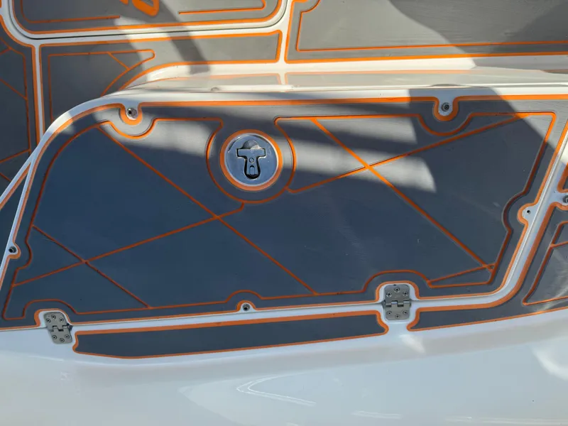 Slide: The Image of Mako 214C 2019 boat deck with orange and gray design details. - 45