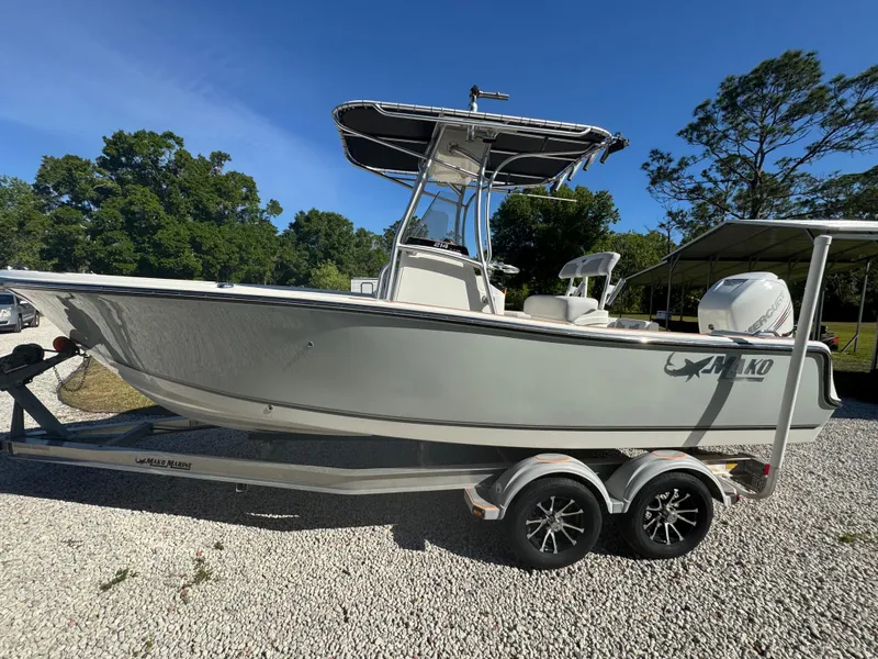 Slide: The Image of 2019 Mako 214C boat on trailer, parked outdoors on gravel. - 9