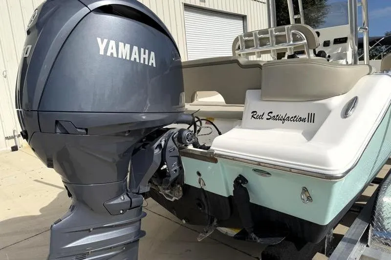Slide: The Image of 2024 Key West 203 FS boat with Yamaha engine, named "Reel Satisfaction III." - 12