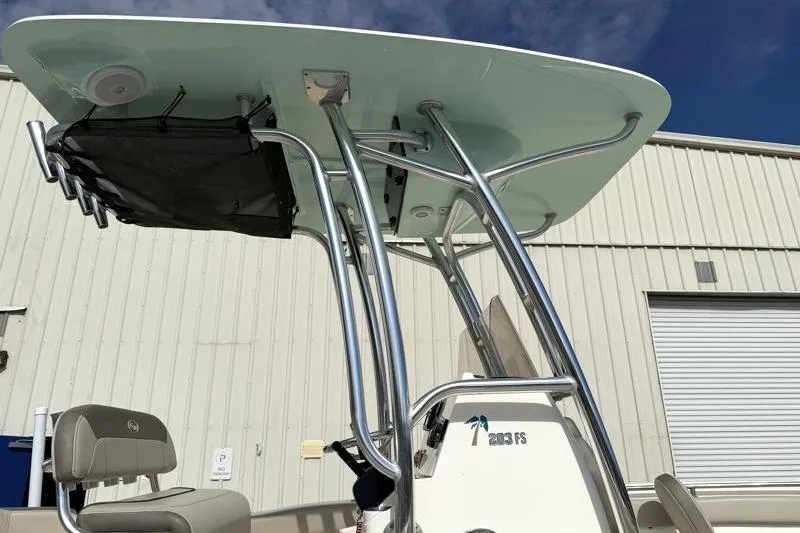 Slide: The Image of 2024 Key West 203 FS boat with T-top and seating, outdoor view. - 15