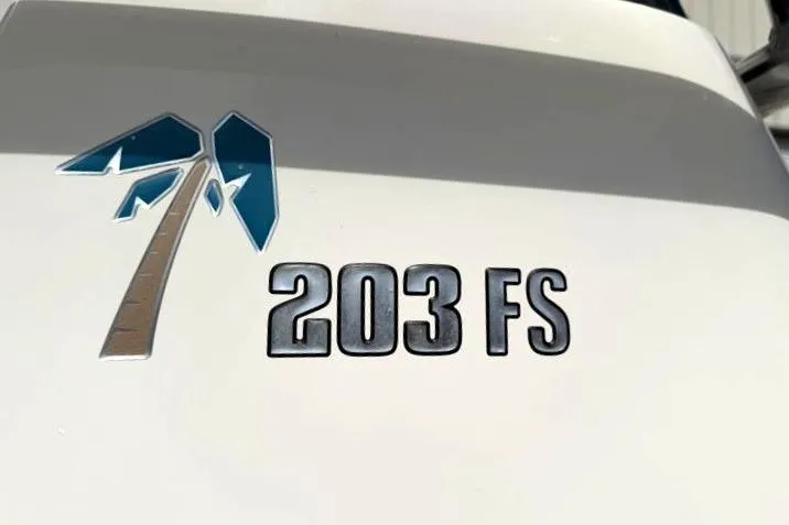 Slide: The Image of 2024 Key West 203 FS boat logo with palm tree design. - 16